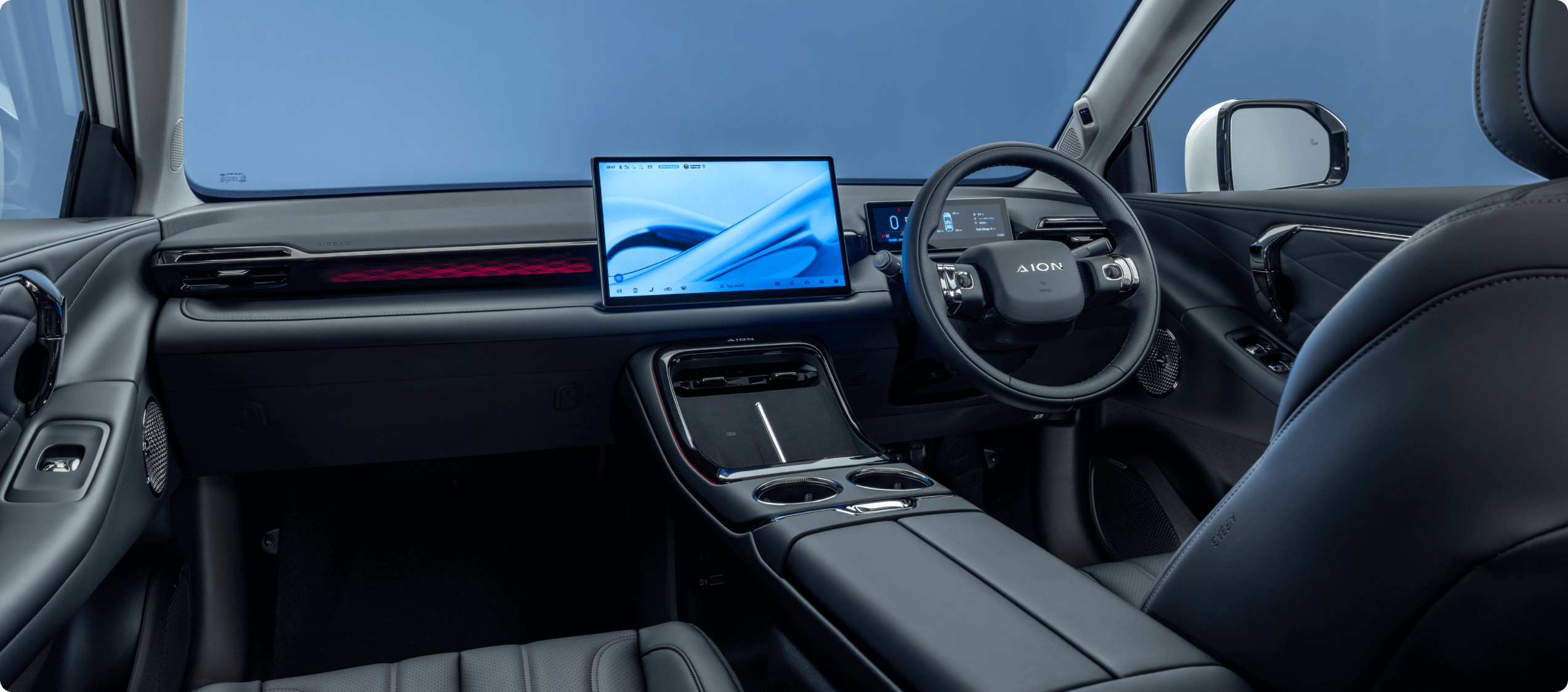 Modern car interior with touchscreen and digital dashboard.