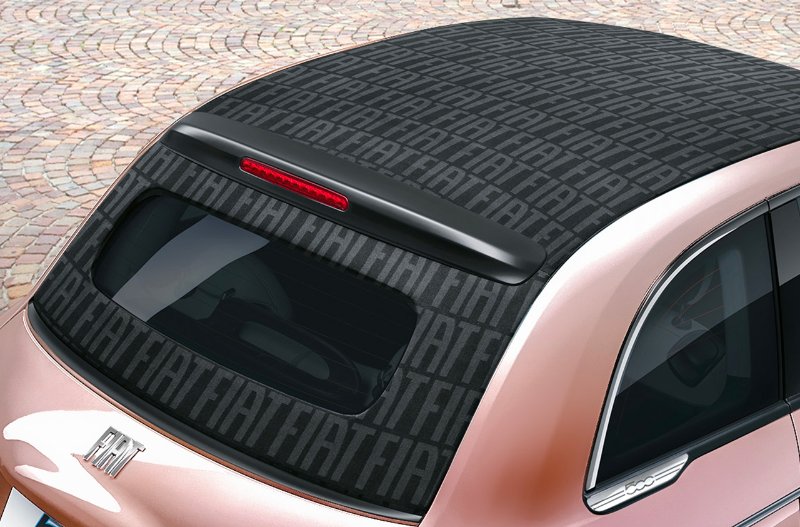 Close-up of a Fiat car roof with repeating FIAT text design.
