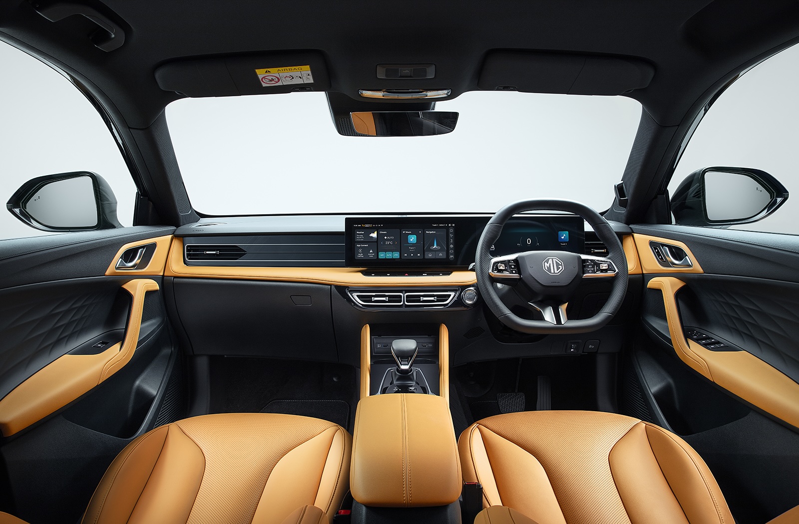 Car interior with tan leather seats and black dashboard featuring a touchscreen display.